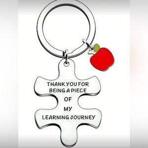 Silver Puzzle Piece Keychain with Red Apple Charm